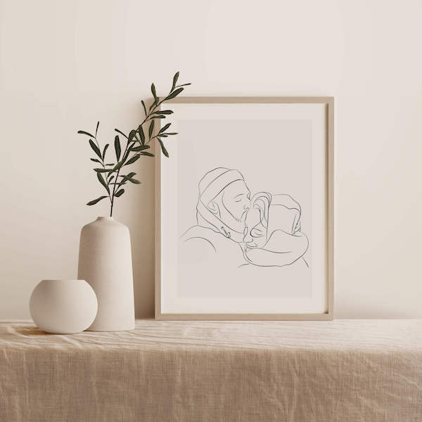 Rysunek Line Art pary, rysunek stoi w ramce na stole obok rośliny